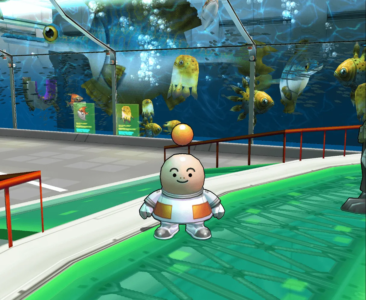 Opoona standing in front of an aquarium.